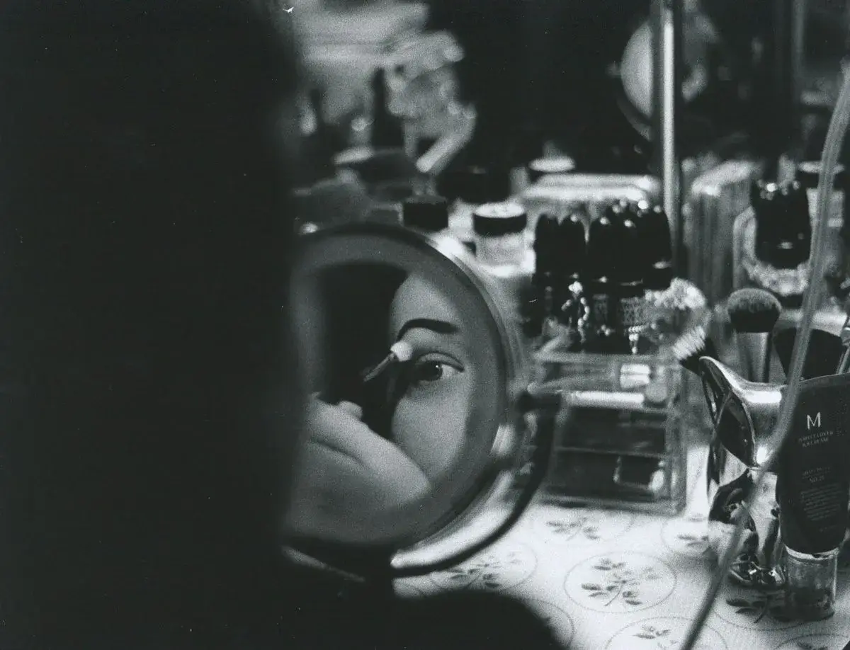 Black-and-white 35mm film portrait of an eye reflected in a makeup mirror, Boise, Idaho, photo by Rusty Rehl