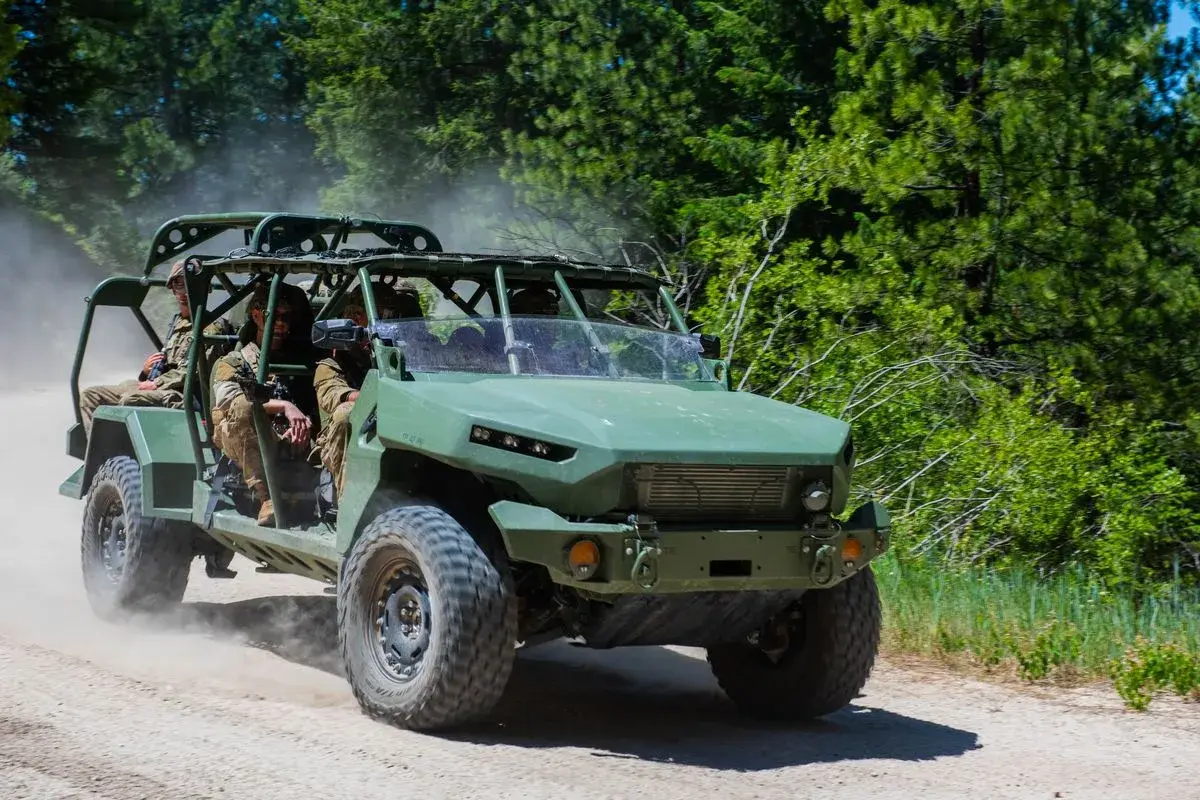 Idaho Army National Guard soldiers drive an Infantry Squad Vehicle down a dirt road, photo by Rusty Rehl