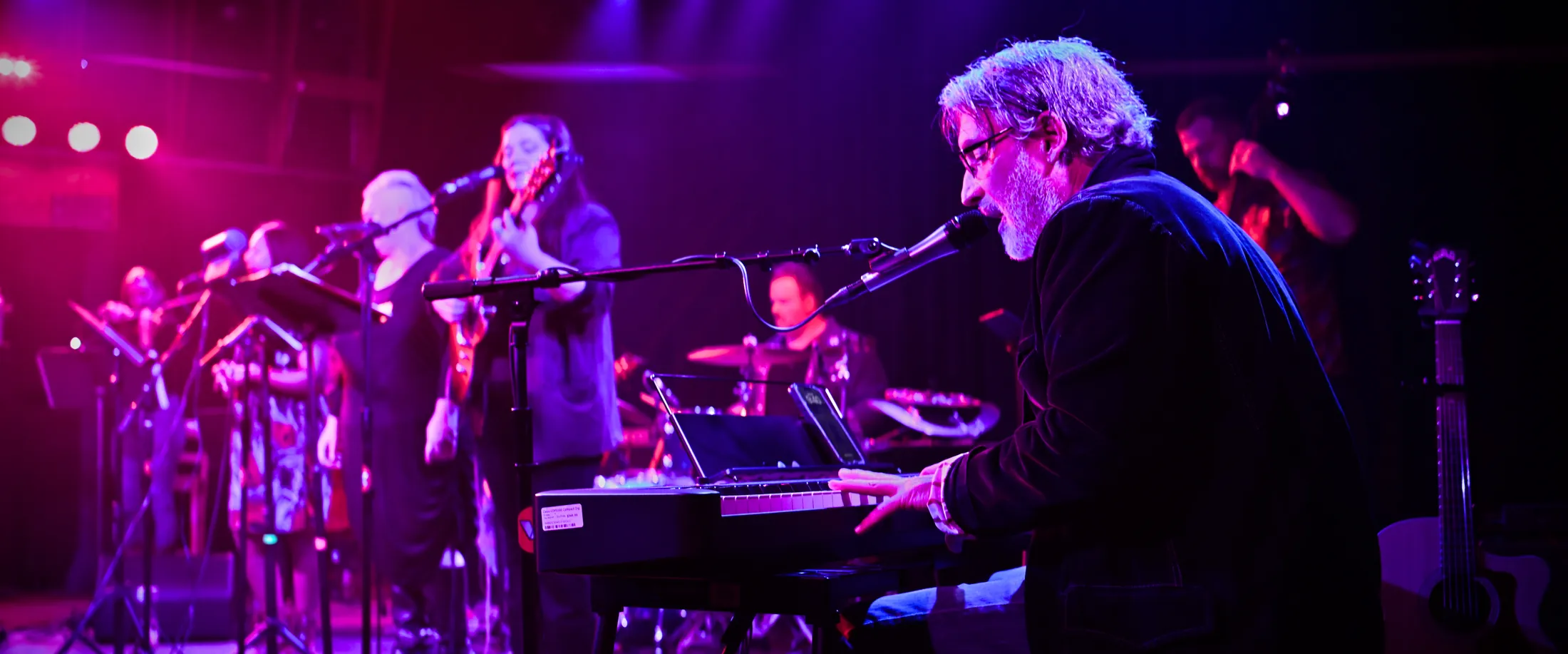 Martin Daniels singing at the keyboard with the band behind him, Boise, Idaho live music photo by Rusty Rehl