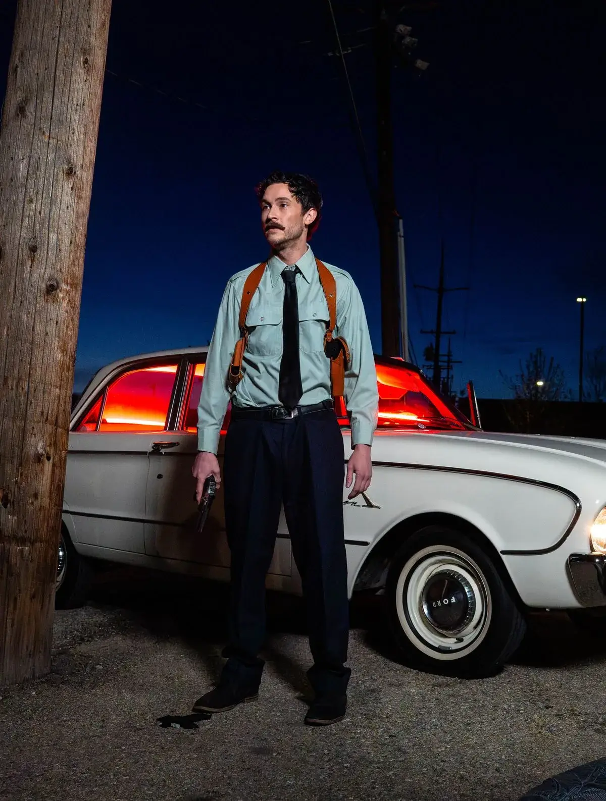 Night portrait of a man beside a classic car on the set of Mason Dodson's short film Smokeshow Joe, Boise, Idaho, photo by Rusty Rehl