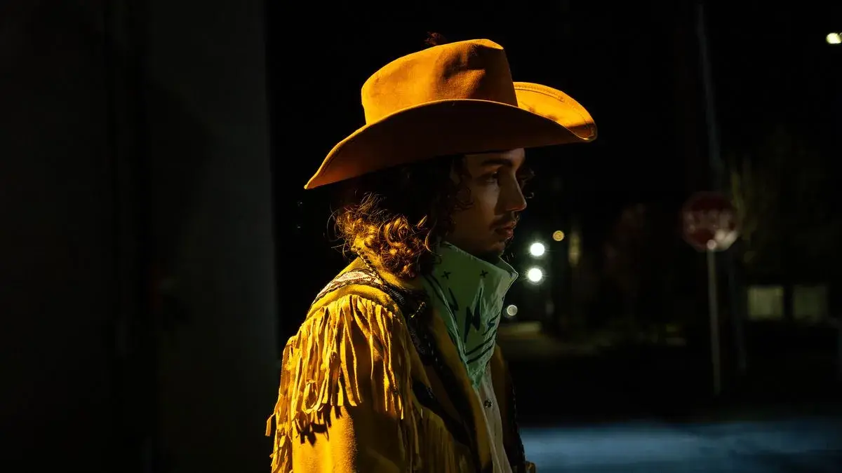 Woman in a cowboy hat and fringe jacket on the set of Mason Dodson's short film Smokeshow Joe, Boise, Idaho, photo by Rusty Rehl